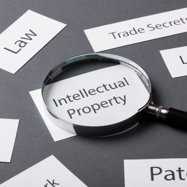 A magnifying glass highlighting intellectual property