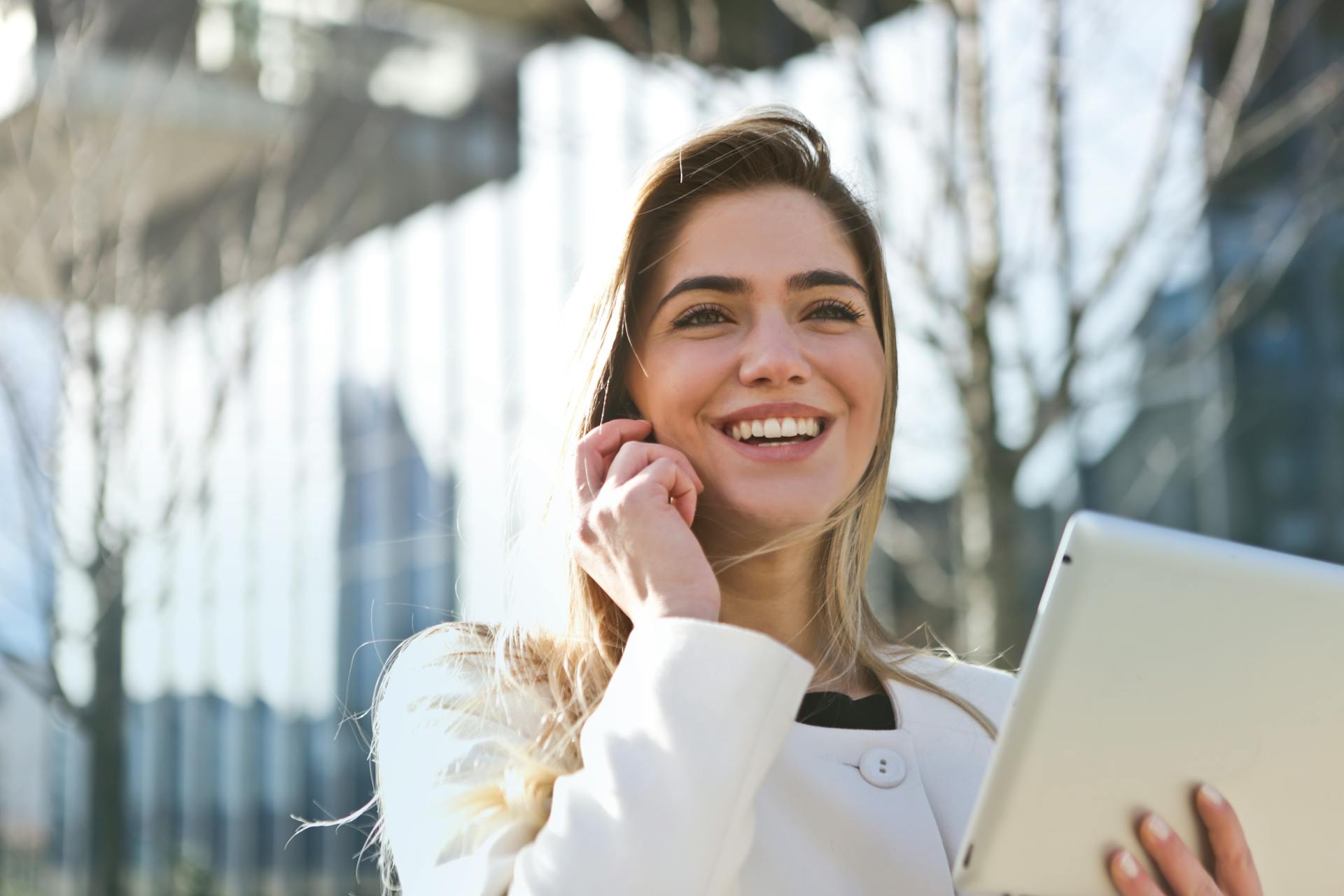 A smiling girl talking to the phone