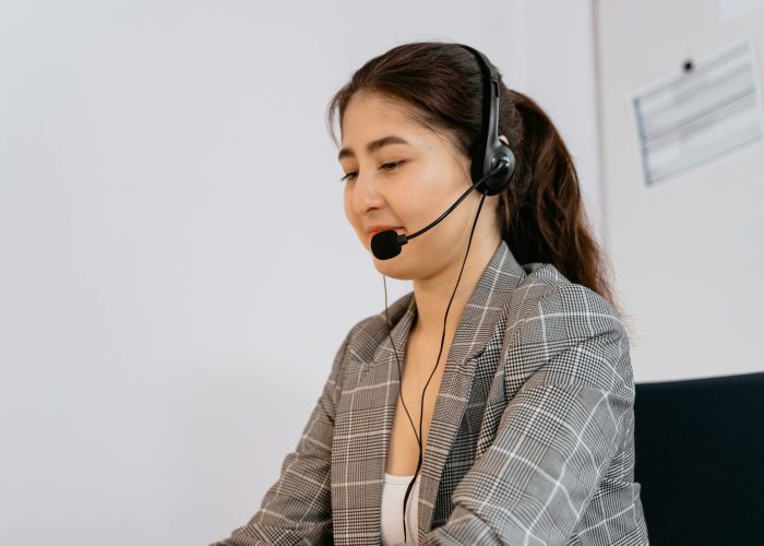 Call center employee talking to the phone